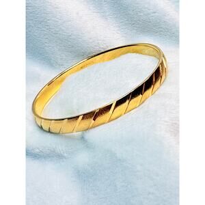 Vintage Monet Gold-Tone Bangle Bracelet with Elegant Diagonal Design Detail